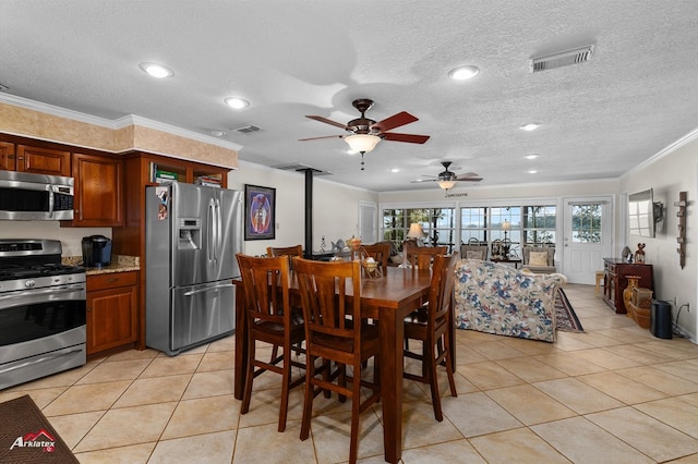 140 Eastwood Dr, Milam, TX 75959 - dining space featuring crown molding, ceiling fan, light tile patterned floors, a textured ceiling, and recessed lighting