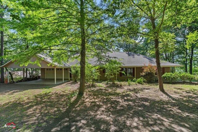 140 Eastwood Dr, Milam, TX 75959 - view of front of property with an attached carport and driveway