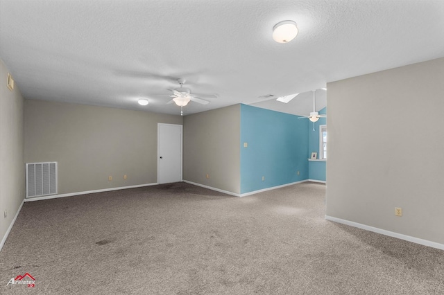 140 Eastwood Dr, Milam, TX 75959 - carpeted empty room with a ceiling fan, a textured ceiling, and baseboards