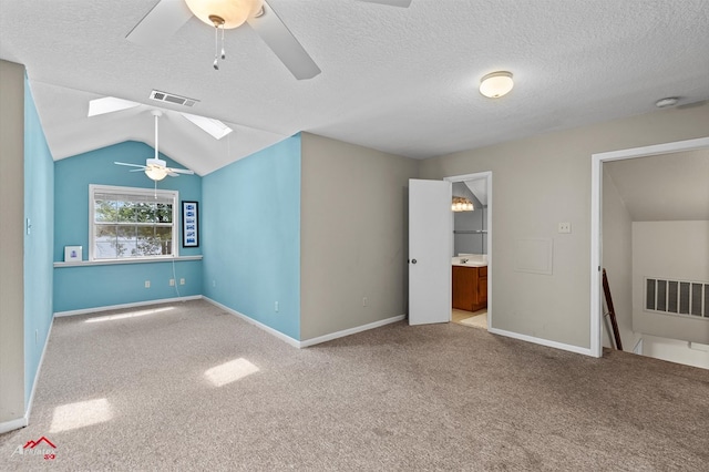 140 Eastwood Dr, Milam, TX 75959 - unfurnished room with ceiling fan, carpet flooring, lofted ceiling, a textured ceiling, and baseboards