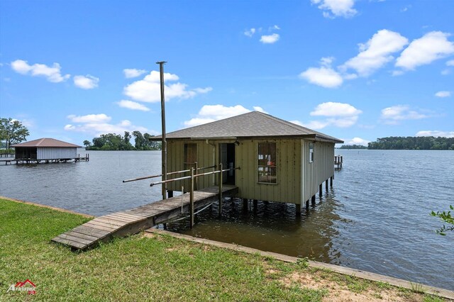 140 Eastwood Dr, Milam, TX 75959 - dock featuring boat lift and a water view
