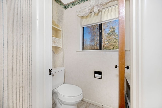 bathroom featuring tile patterned floors and toilet