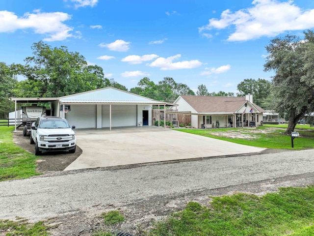 single story home featuring a carport and a front yard