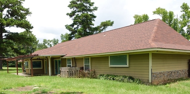 600 Daily St, Jasper, TX 75951 - back of property with a yard and a shingled roof