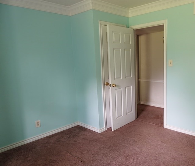 600 Daily St, Jasper, TX 75951 - spare room featuring dark carpet and crown molding