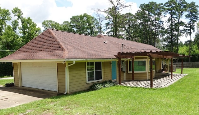 600 Daily St, Jasper, TX 75951 - view of front of property with a pergola, a garage, a patio area, and roof with shingles