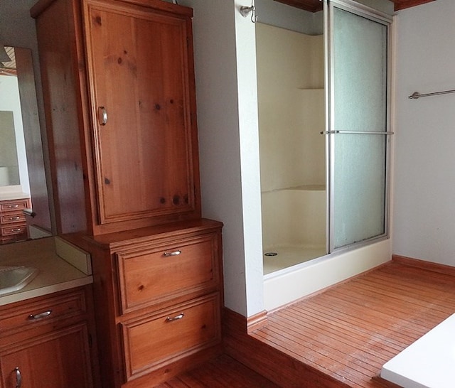 600 Daily St, Jasper, TX 75951 - bathroom with vanity, a shower stall, and wood finished floors