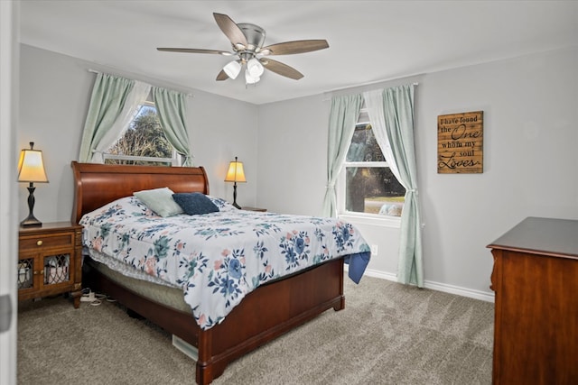 bedroom with multiple windows, light carpet, and ceiling fan