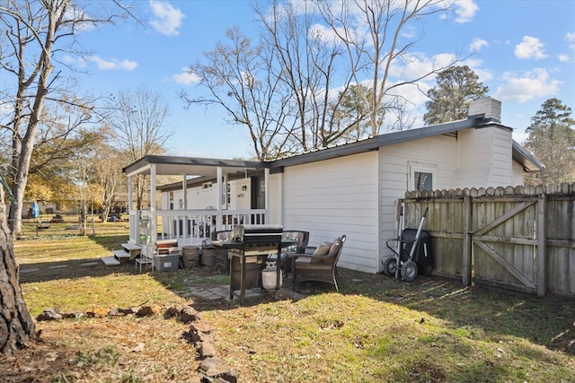 rear view of house with a lawn