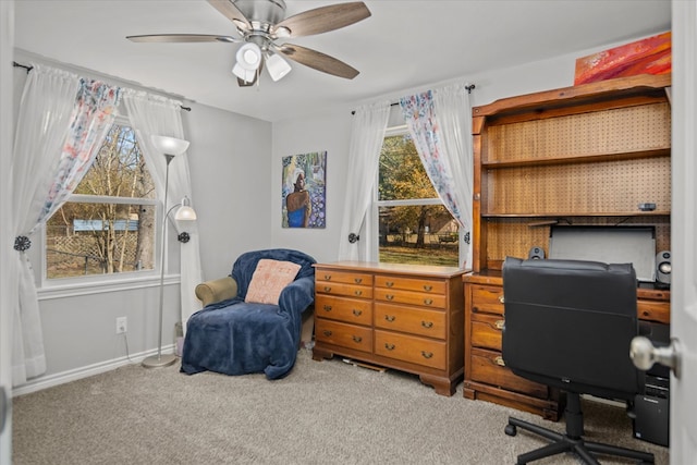 home office featuring carpet floors and ceiling fan