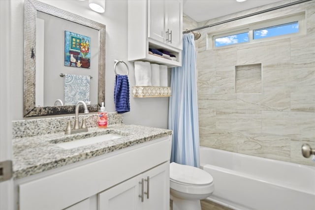 full bathroom with vanity, toilet, and shower / bath combo with shower curtain