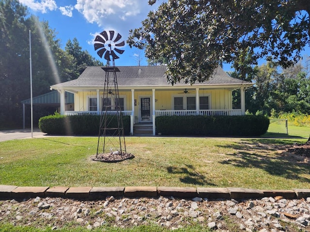 view of front of house featuring covered porch and a front lawn