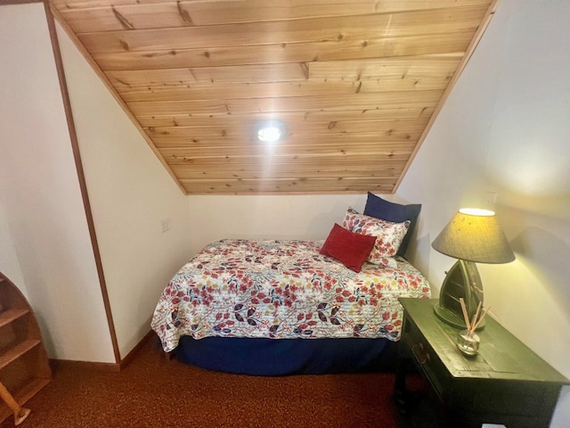 bedroom with wooden ceiling, baseboards, and lofted ceiling