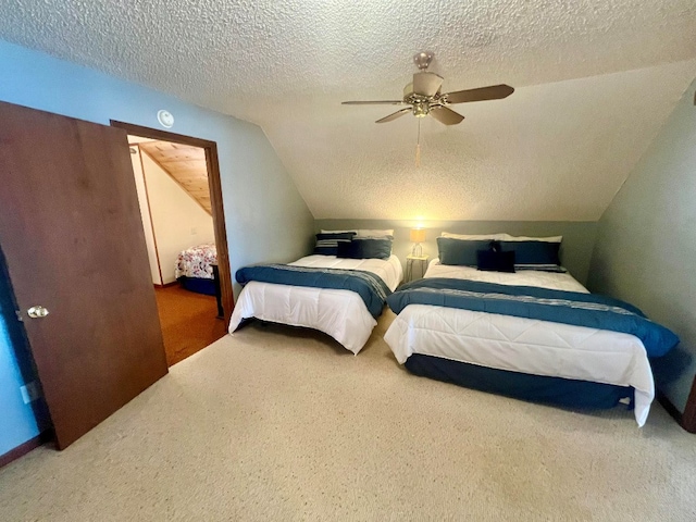 carpeted bedroom with a textured ceiling, ceiling fan, and vaulted ceiling
