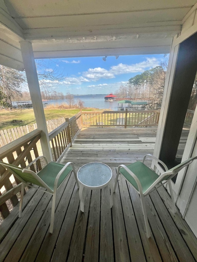 wooden terrace with a water view