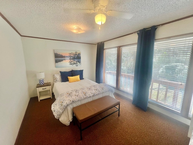 carpeted bedroom featuring crown molding, a ceiling fan, and a textured ceiling