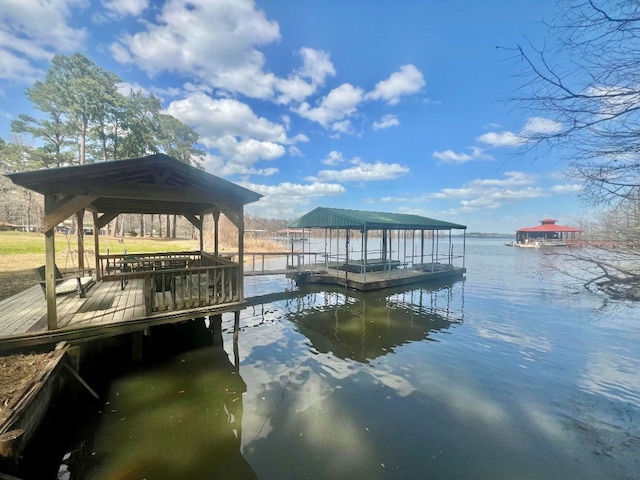 view of dock featuring a gazebo and a water view
