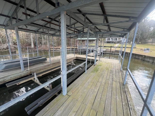 dock area featuring a water view and boat lift