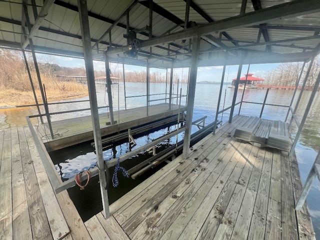 view of dock featuring a water view and boat lift