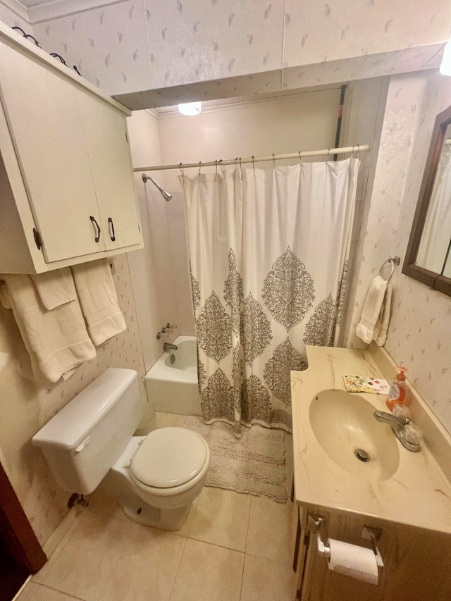bathroom featuring tile patterned flooring, wallpapered walls, toilet, shower / bath combo with shower curtain, and vanity