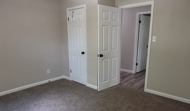 1604 Lilac Ave, Lufkin, TX 75901 - spare room featuring dark carpet and baseboards