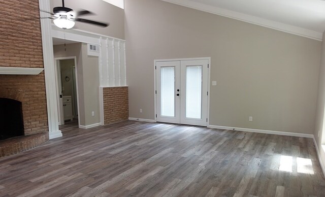1604 Lilac Ave, Lufkin, TX 75901 - unfurnished living room with a ceiling fan, wood finished floors, baseboards, french doors, and high vaulted ceiling