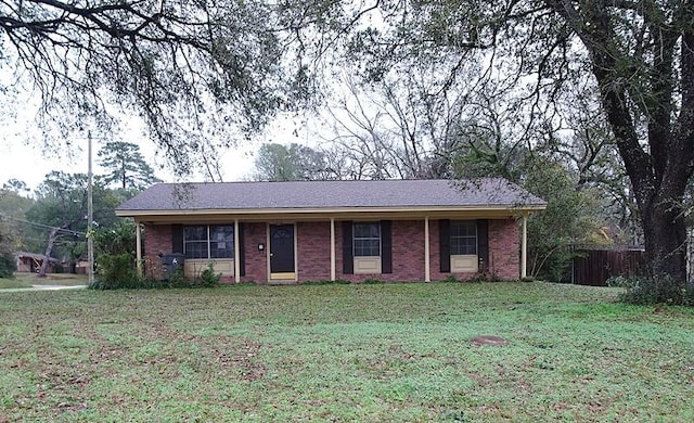 ranch-style home with a front lawn