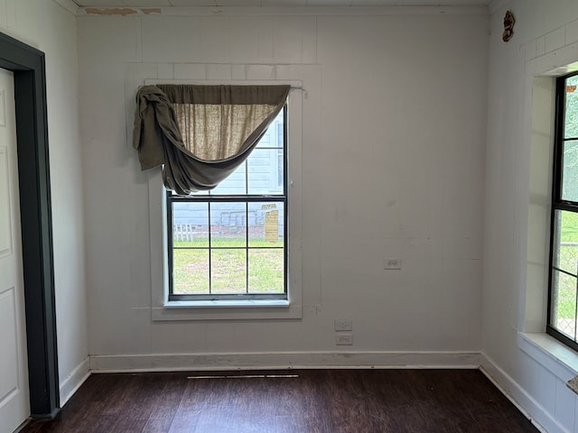 730 Kiln St, Lufkin, TX 75904 - unfurnished room with dark wood-style floors and baseboards