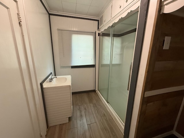 730 Kiln St, Lufkin, TX 75904 - bathroom featuring vanity, a stall shower, and wood finished floors