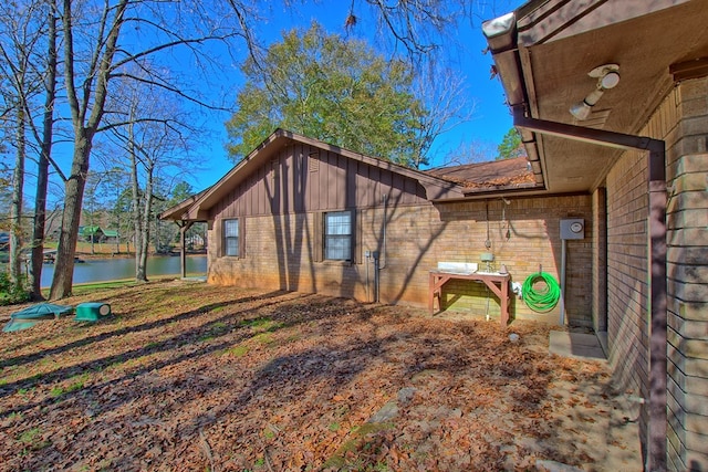 view of home's exterior with a water view