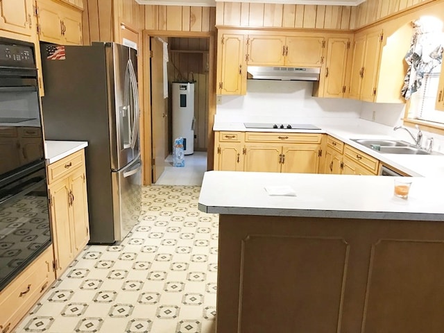 kitchen with under cabinet range hood, a sink, water heater, stainless steel fridge, and black electric cooktop