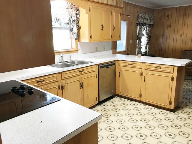 kitchen featuring crown molding, light floors, dishwasher, light countertops, and a peninsula