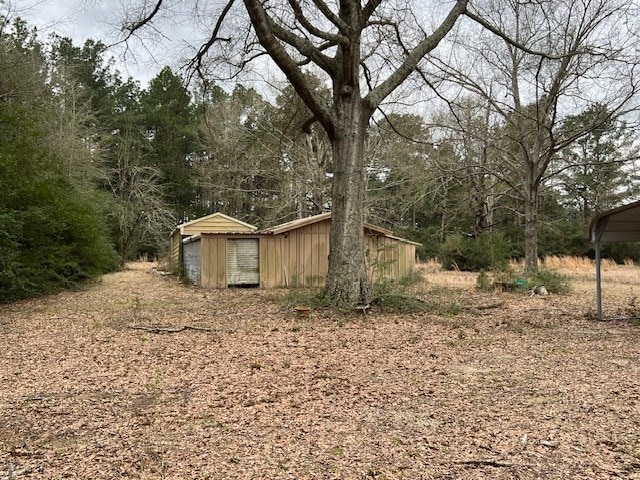 365 Roughrider Dr, Center, TX 75935 - view of yard featuring an outbuilding