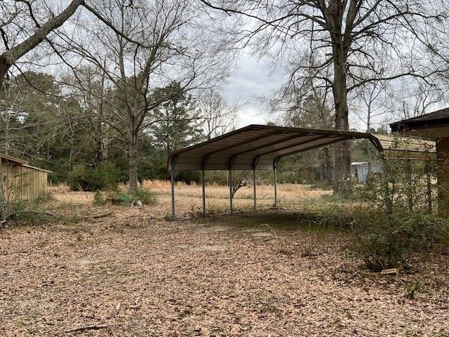 view of property's community featuring a carport and driveway