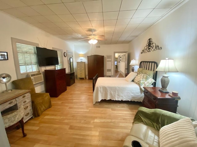 bedroom featuring ceiling fan and light hardwood / wood-style flooring