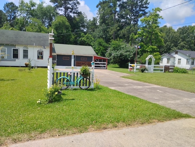 5003 Lotus Ln, Lufkin, TX 75904 - view of front of house with a front yard, roof with shingles, and driveway