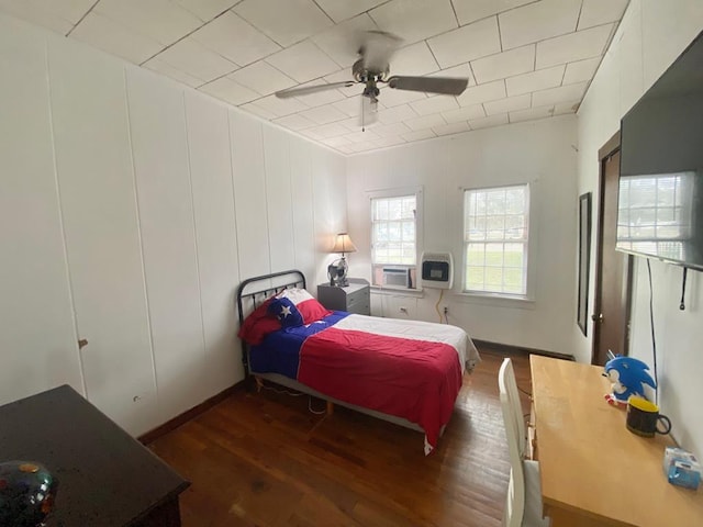 bedroom with ceiling fan and dark hardwood / wood-style floors