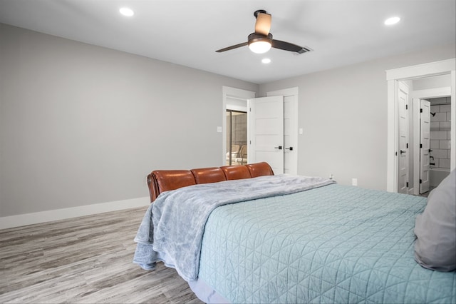 bedroom with ceiling fan and light hardwood / wood-style floors