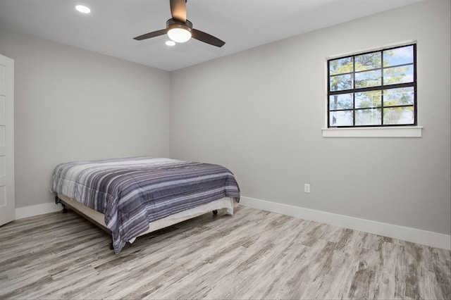 bedroom featuring ceiling fan and light hardwood / wood-style floors