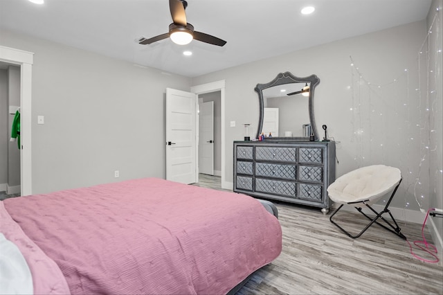 bedroom featuring hardwood / wood-style flooring and ceiling fan