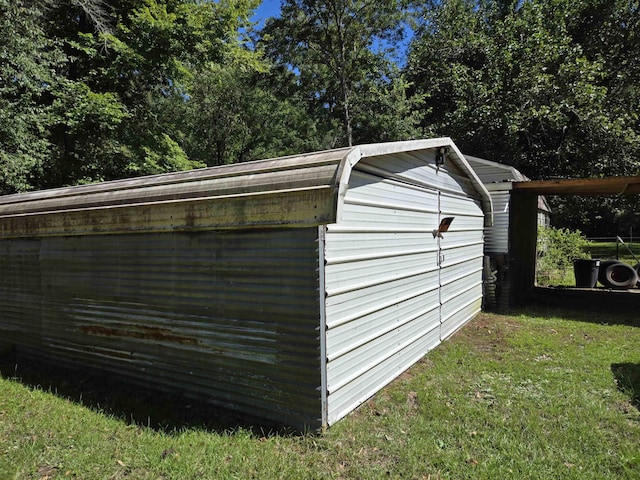 view of outdoor structure featuring a yard