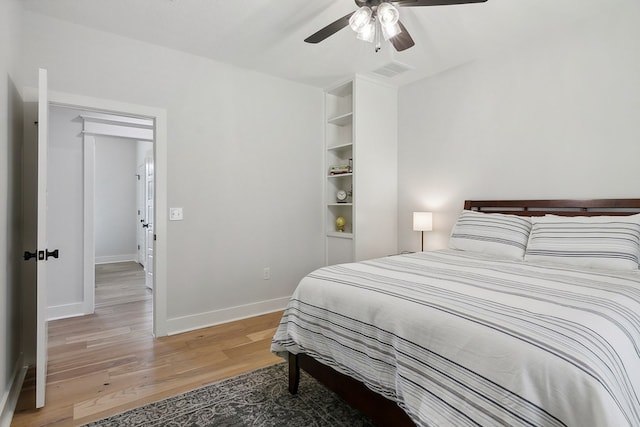 bedroom featuring hardwood / wood-style floors and ceiling fan