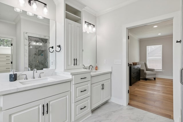 bathroom with vanity, crown molding, and a wealth of natural light