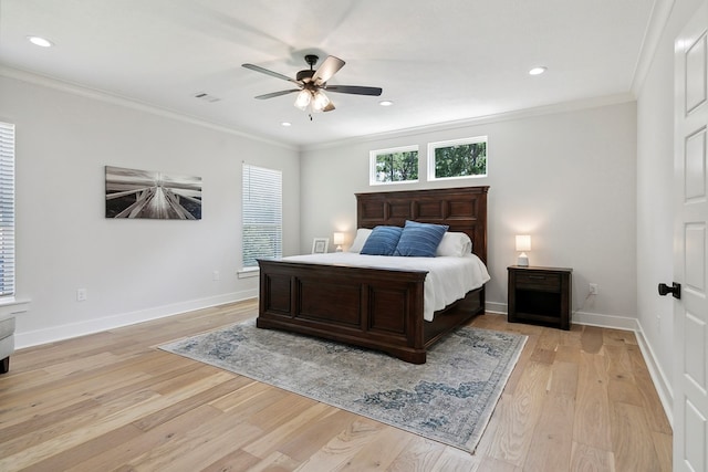 bedroom featuring ceiling fan, light wood-type flooring, and crown molding