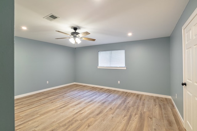 unfurnished room with ceiling fan and light hardwood / wood-style flooring