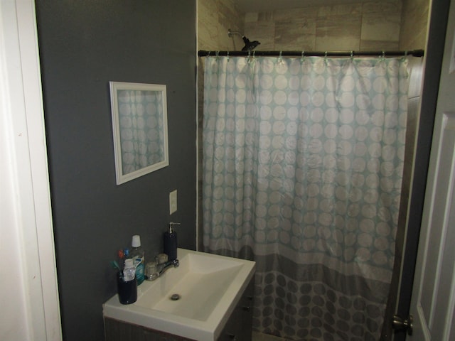 bathroom with curtained shower and sink