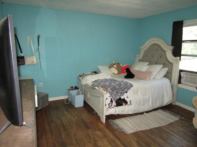 bedroom featuring dark hardwood / wood-style floors