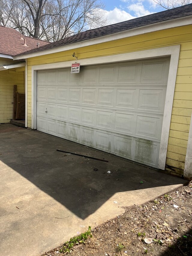 garage featuring driveway