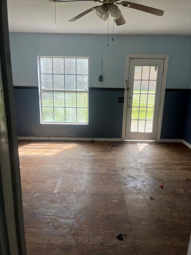 unfurnished room with a ceiling fan