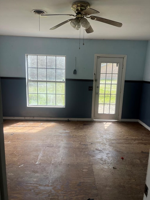 spare room with a ceiling fan and visible vents